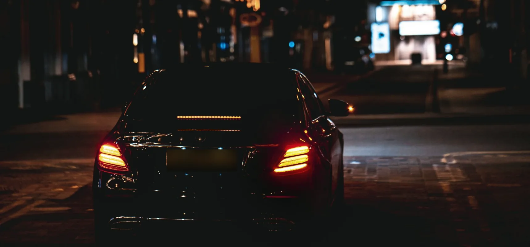 A car on a quiet street at night