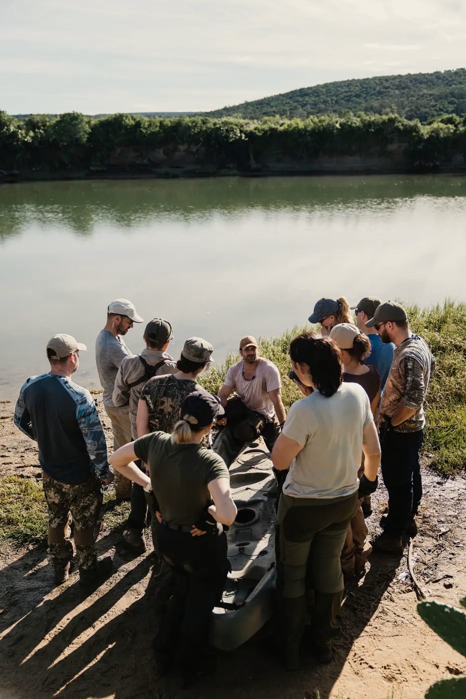 A field briefing at the water's edge